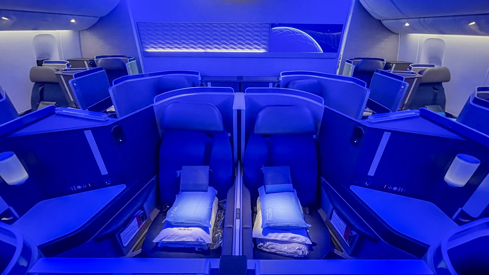 United Airlines Polaris business class cabin on a Boeing 777-300ER aircraft.