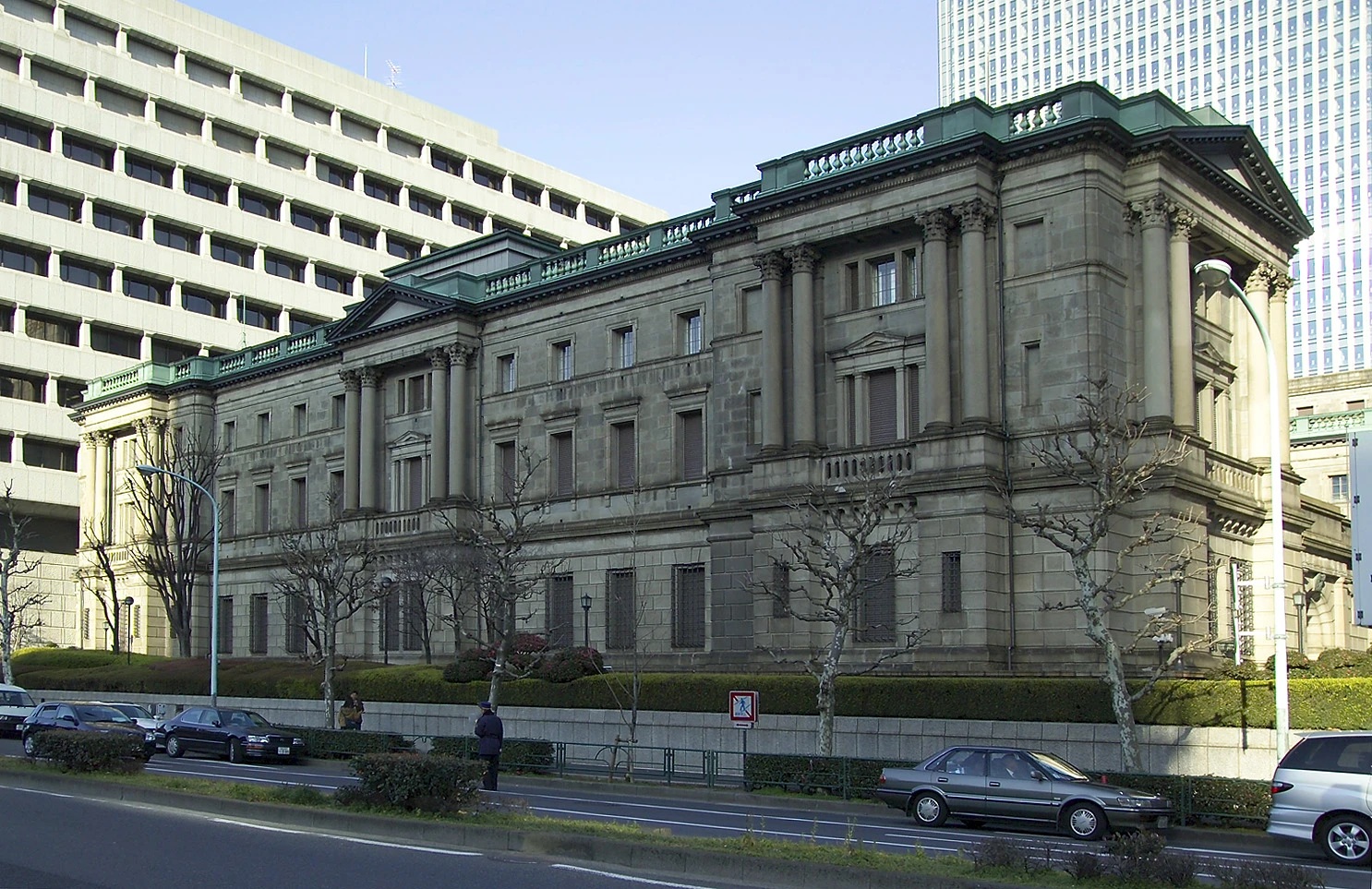 Bank of Japan headquarters, a large stone building with columns, in Tokyo.