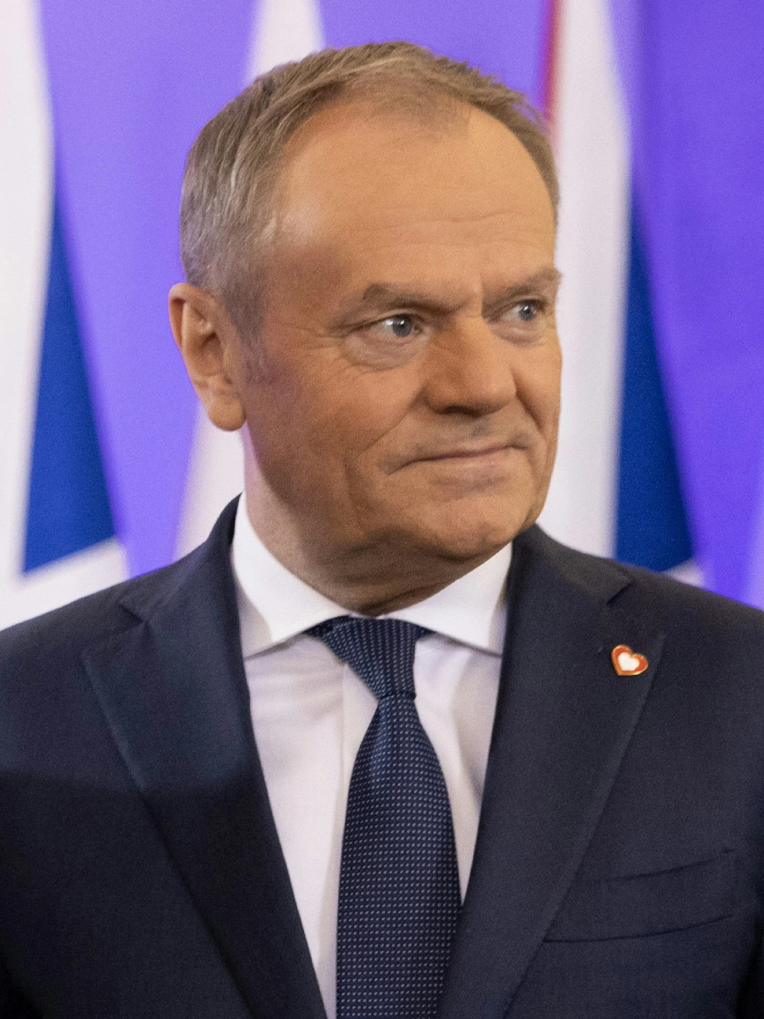 Donald Tusk, Prime Minister of Poland, looking to the side.