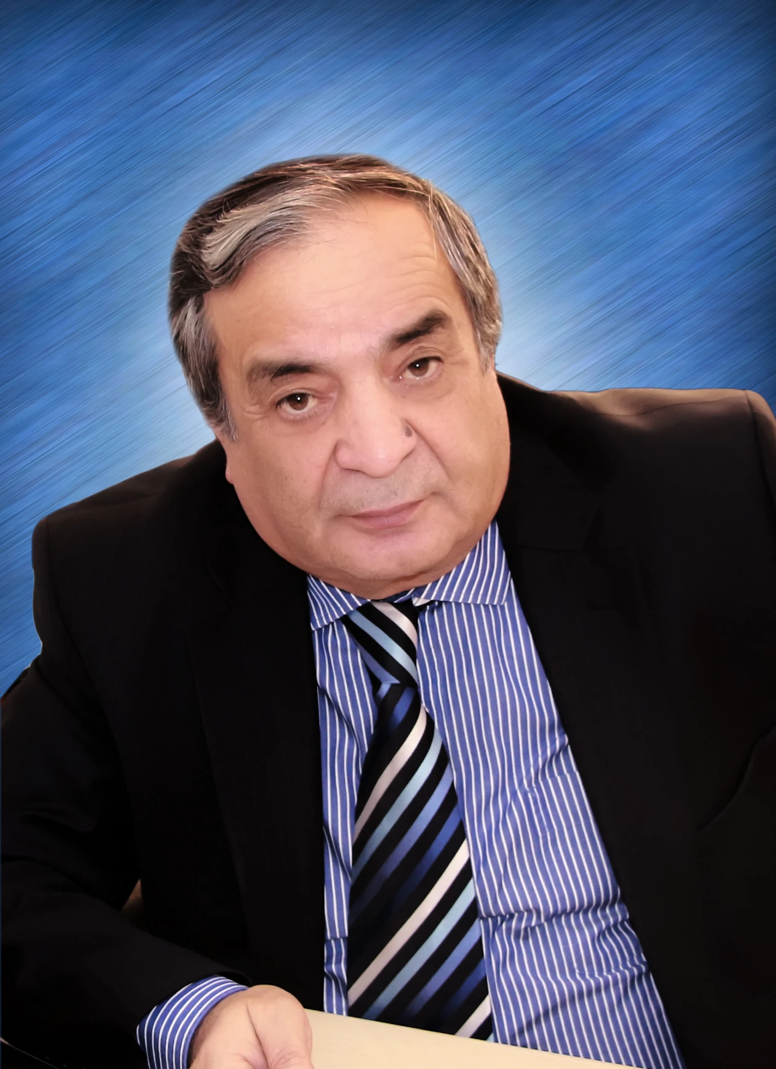 Rahmon Ulmasov, chief economist of a state-owned bank, looking at the camera.