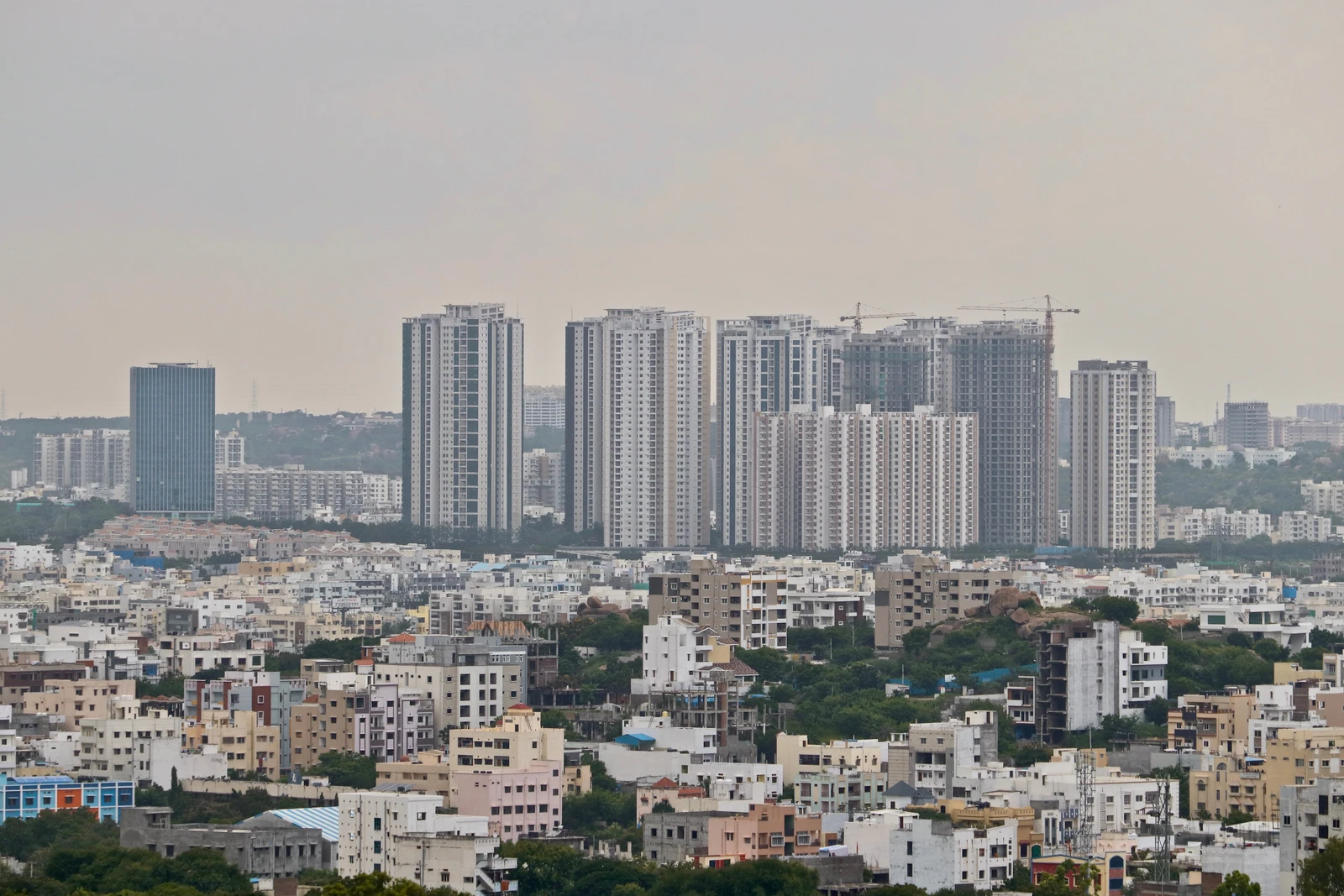 High-rise buildings under construction and completed in Madhapur, Hyderabad, India.