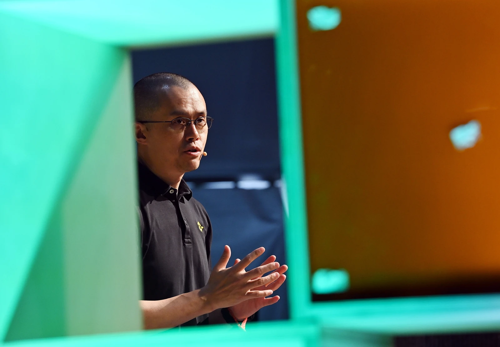 Changpeng Zhao, CEO of Binance, speaking at a public event.