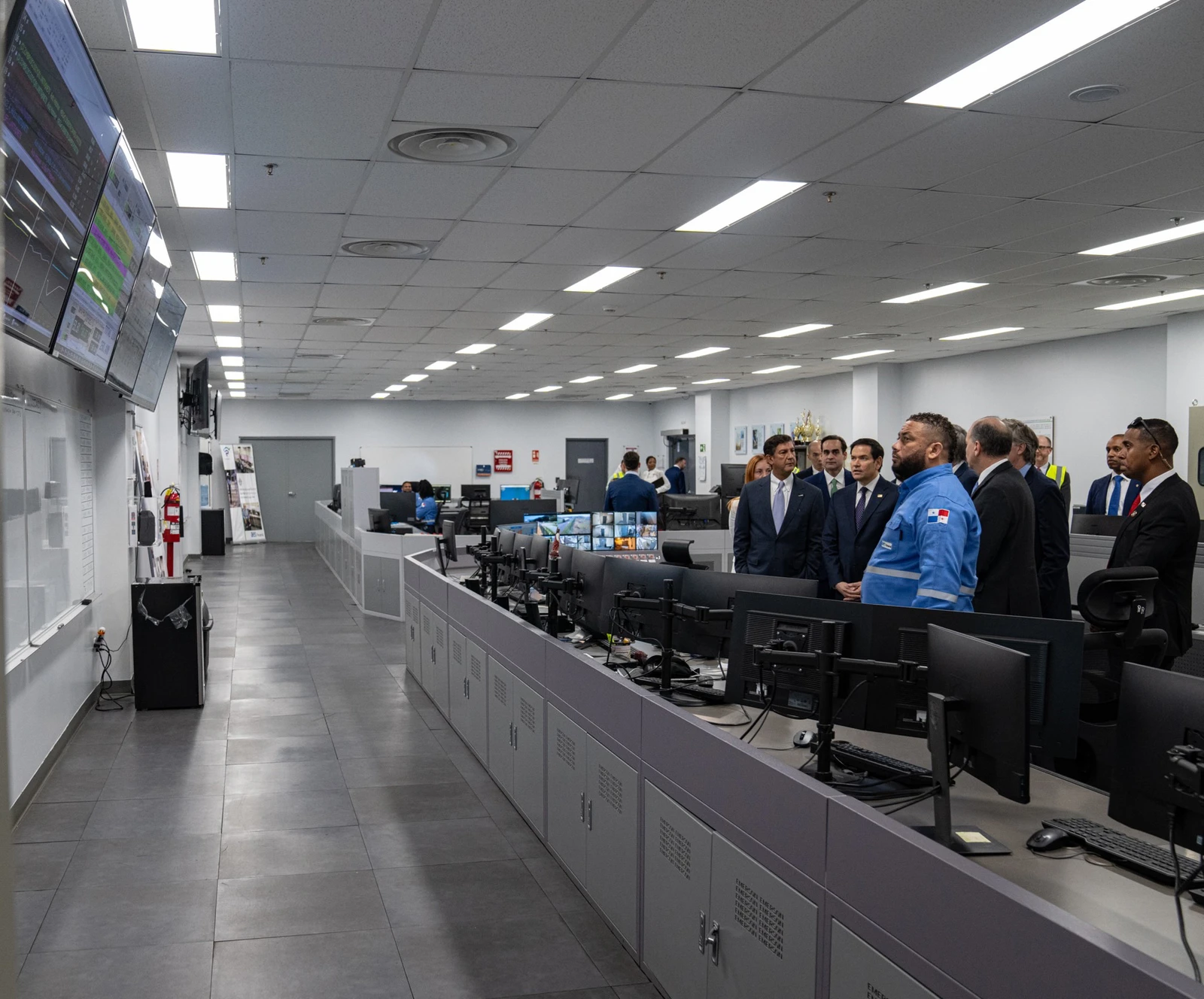 Secretary Rubio and a group of officials observe a control room at a liquified natural gas facility.