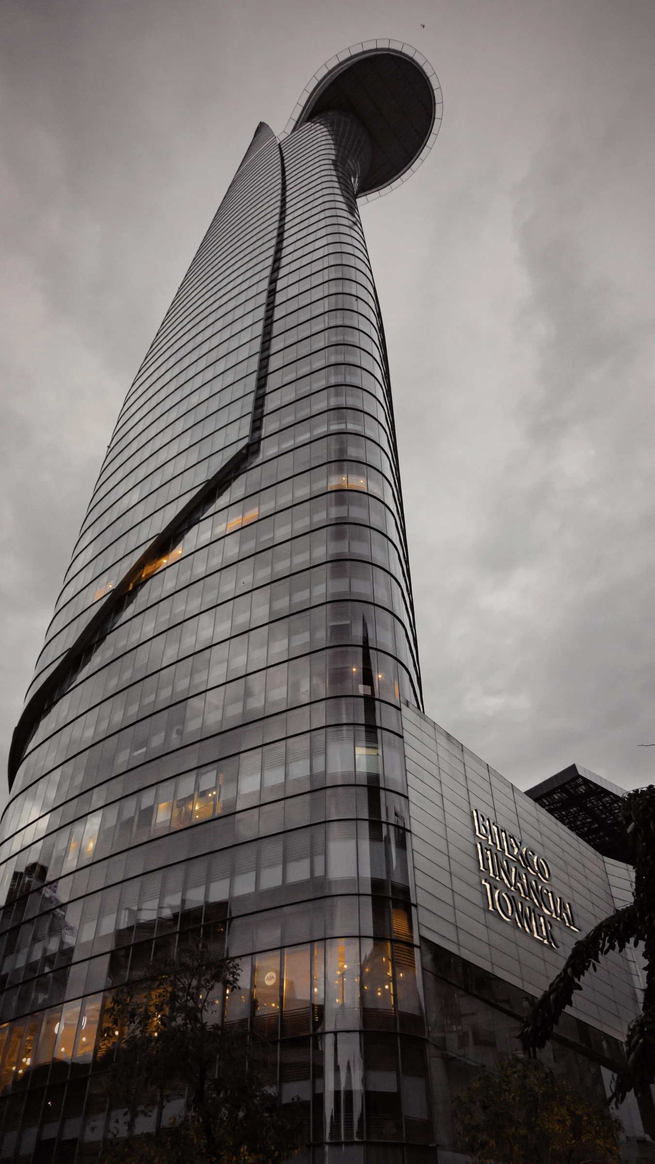 Image of Bitexco Financial Tower in Ho Chi Minh City, Vietnam, against a grey sky.