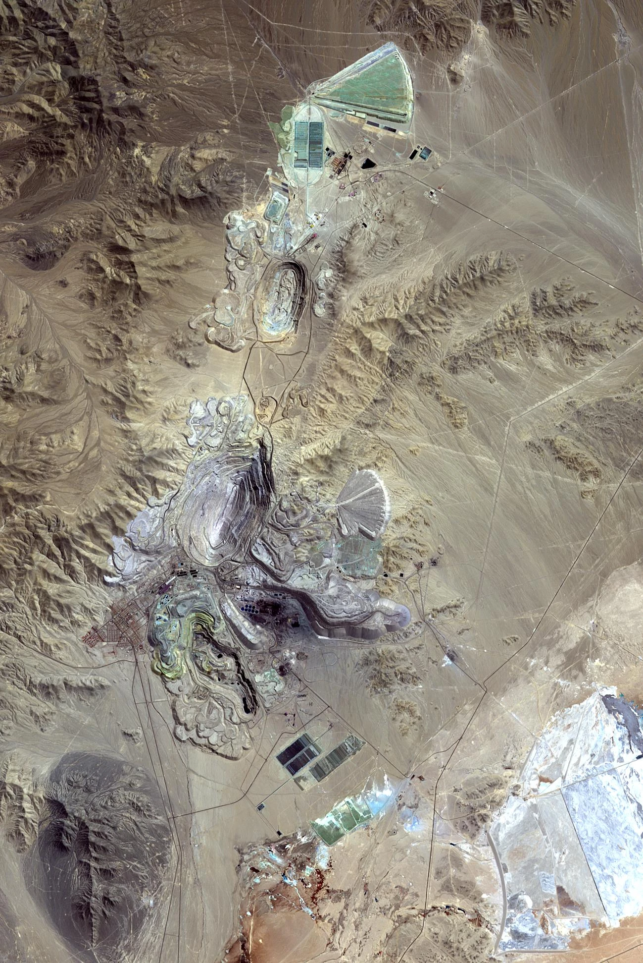 Aerial view of the vast open-pit Chuquicamata copper mine in the Atacama Desert, Chile.