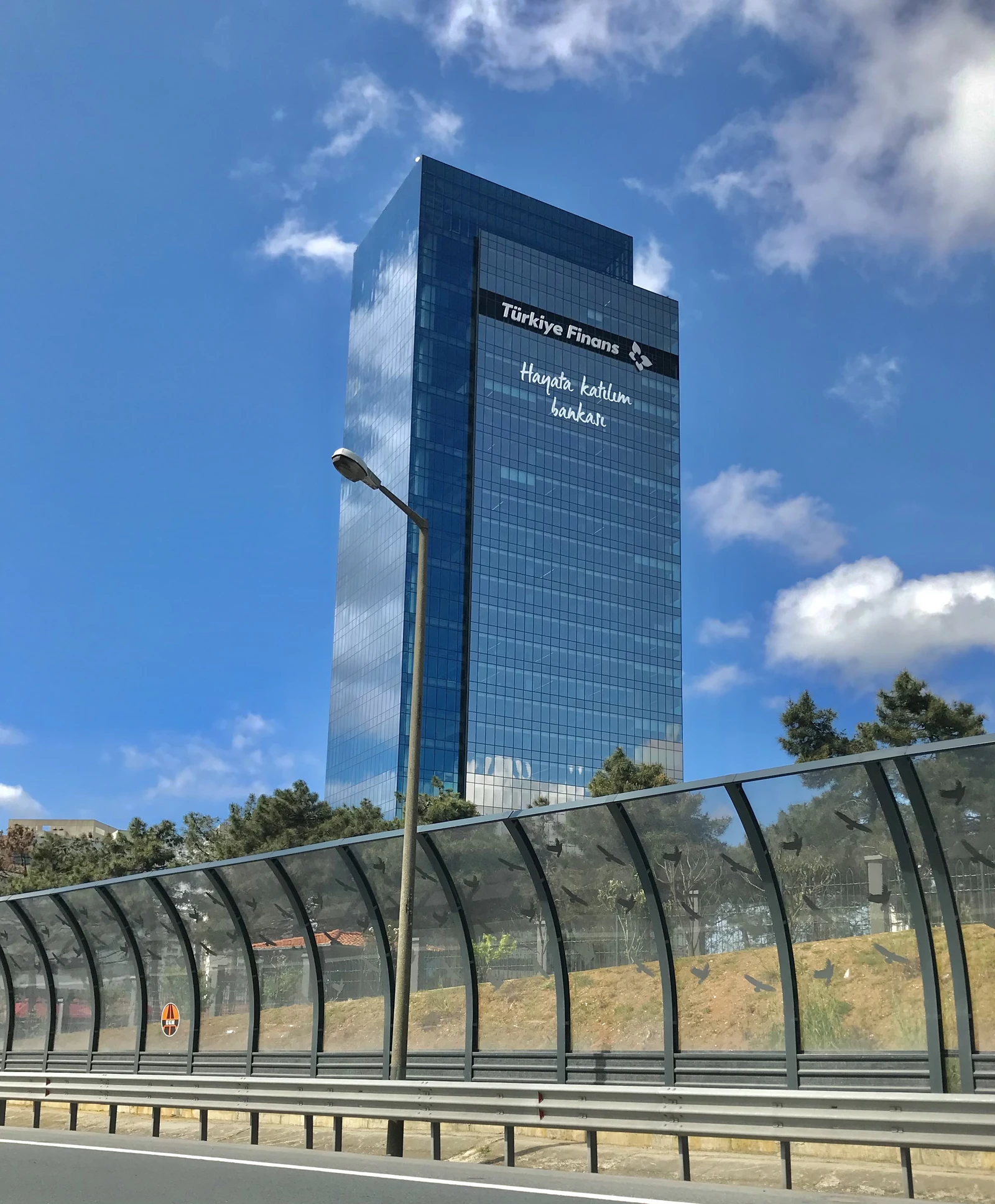 Headquarters of Türkiye Finans Bank, a modern glass skyscraper in Istanbul.