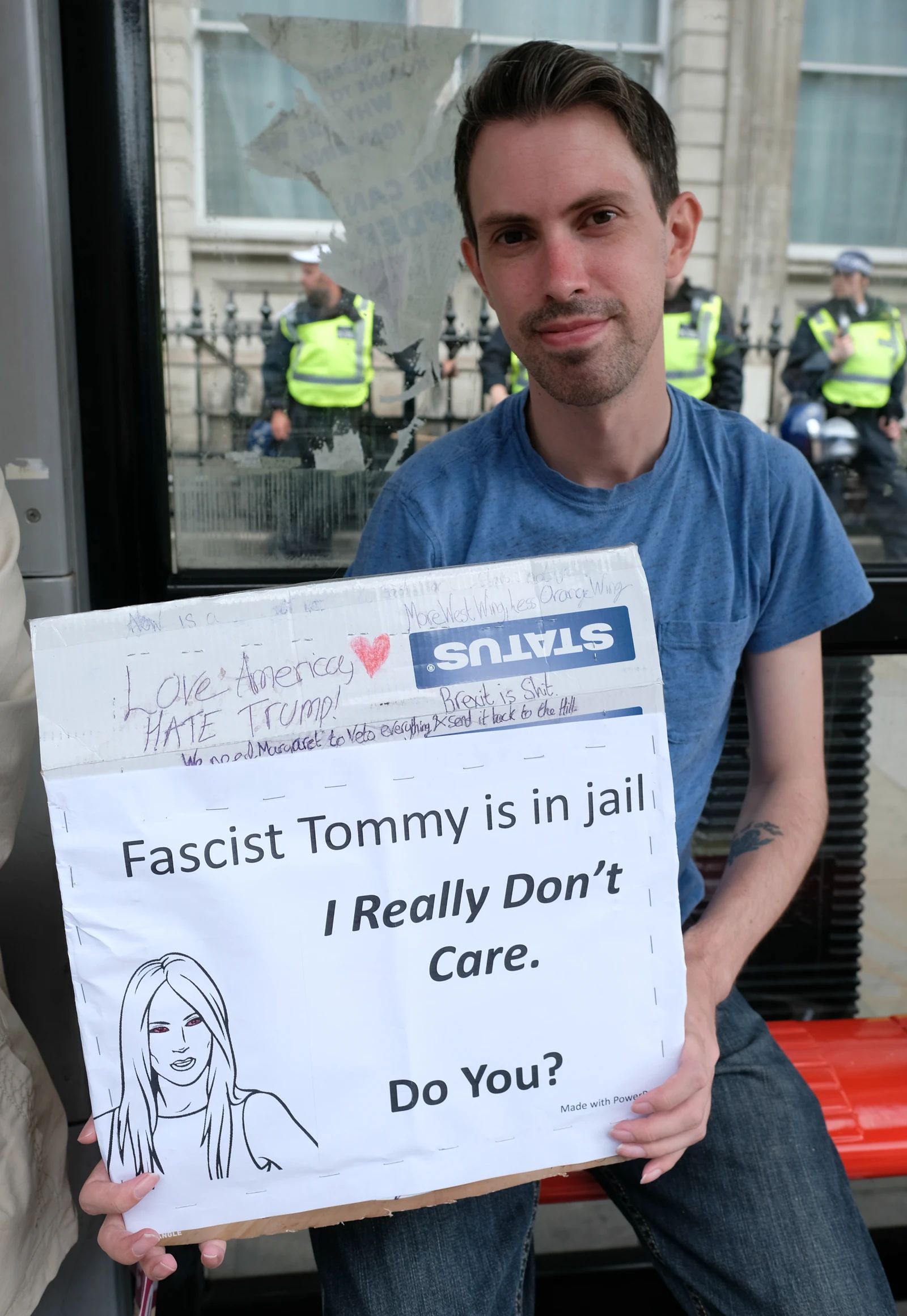 A man holds a sign during a protest against the far right.