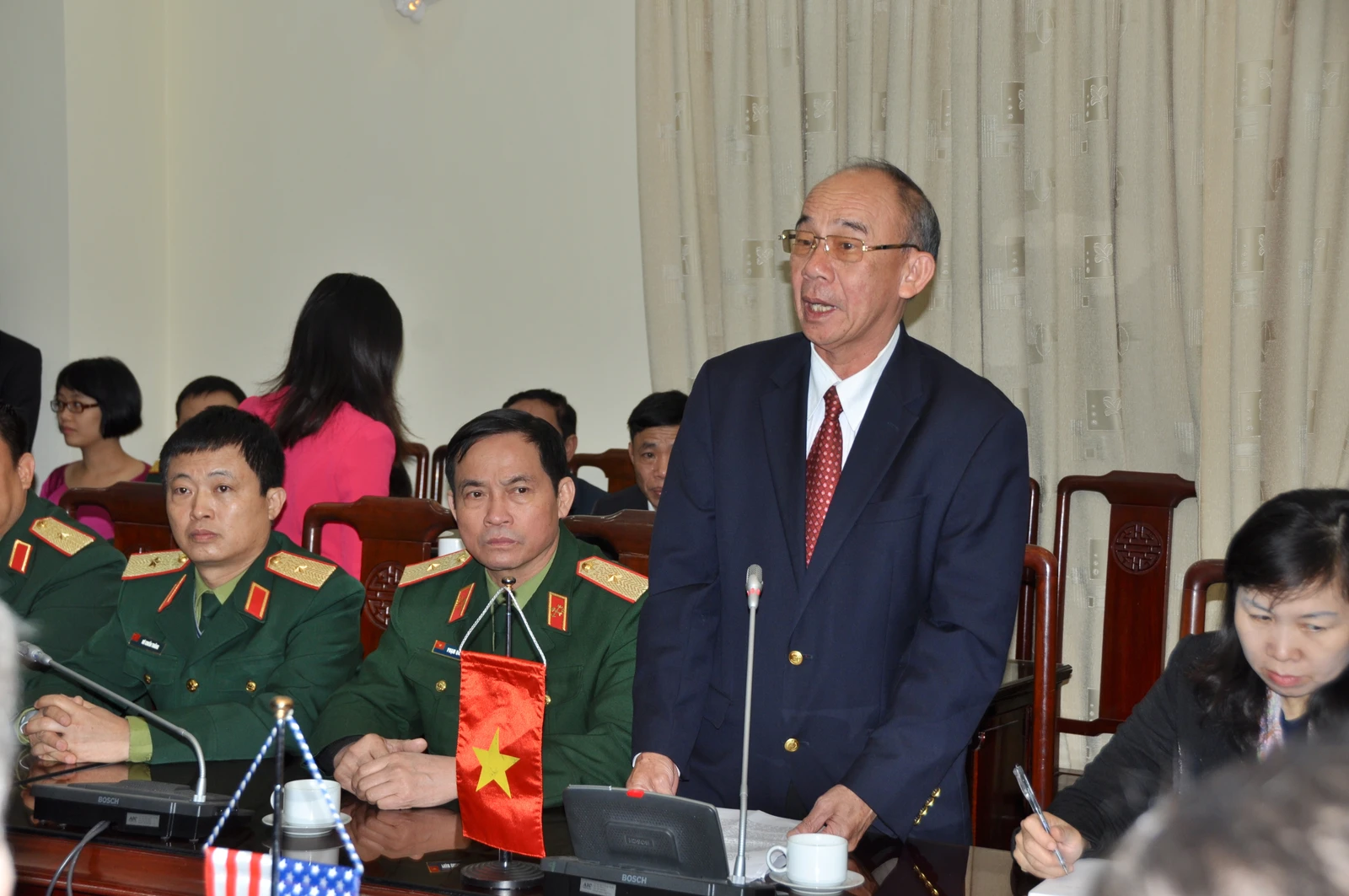Bui Hong Linh, Vietnam’s Vice-Minister of MOLISA, speaking at a podium during a ceremony.