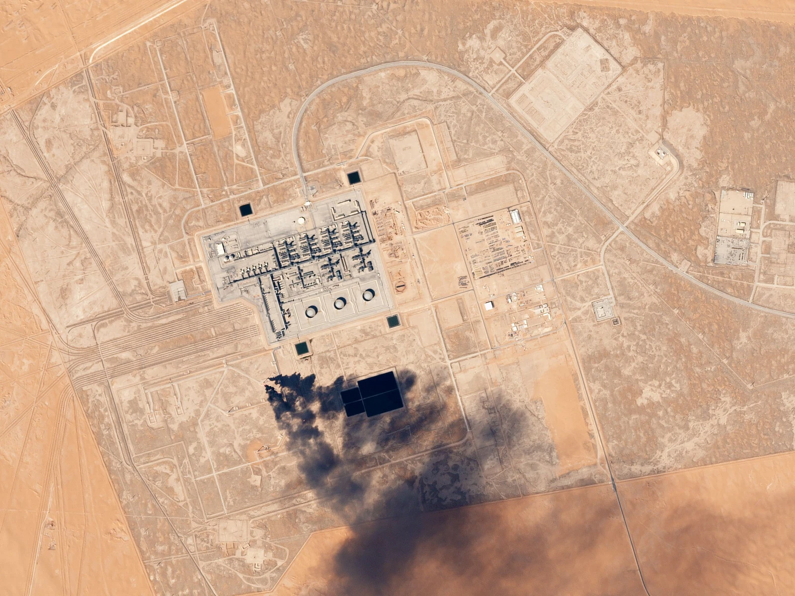 Aerial view showing the Khurais Oil Processing Facility, a large industrial complex in a desert.