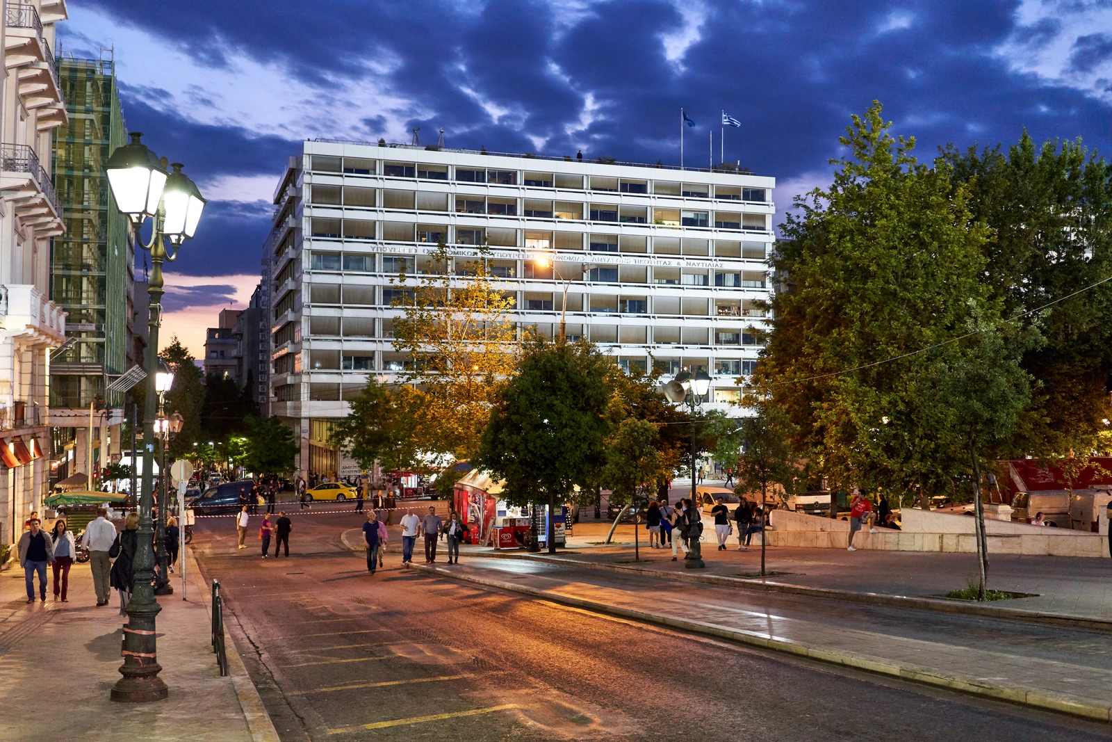 Exterior view of the Hellenic Ministry of Finance building in Athens, Greece, at dusk.
