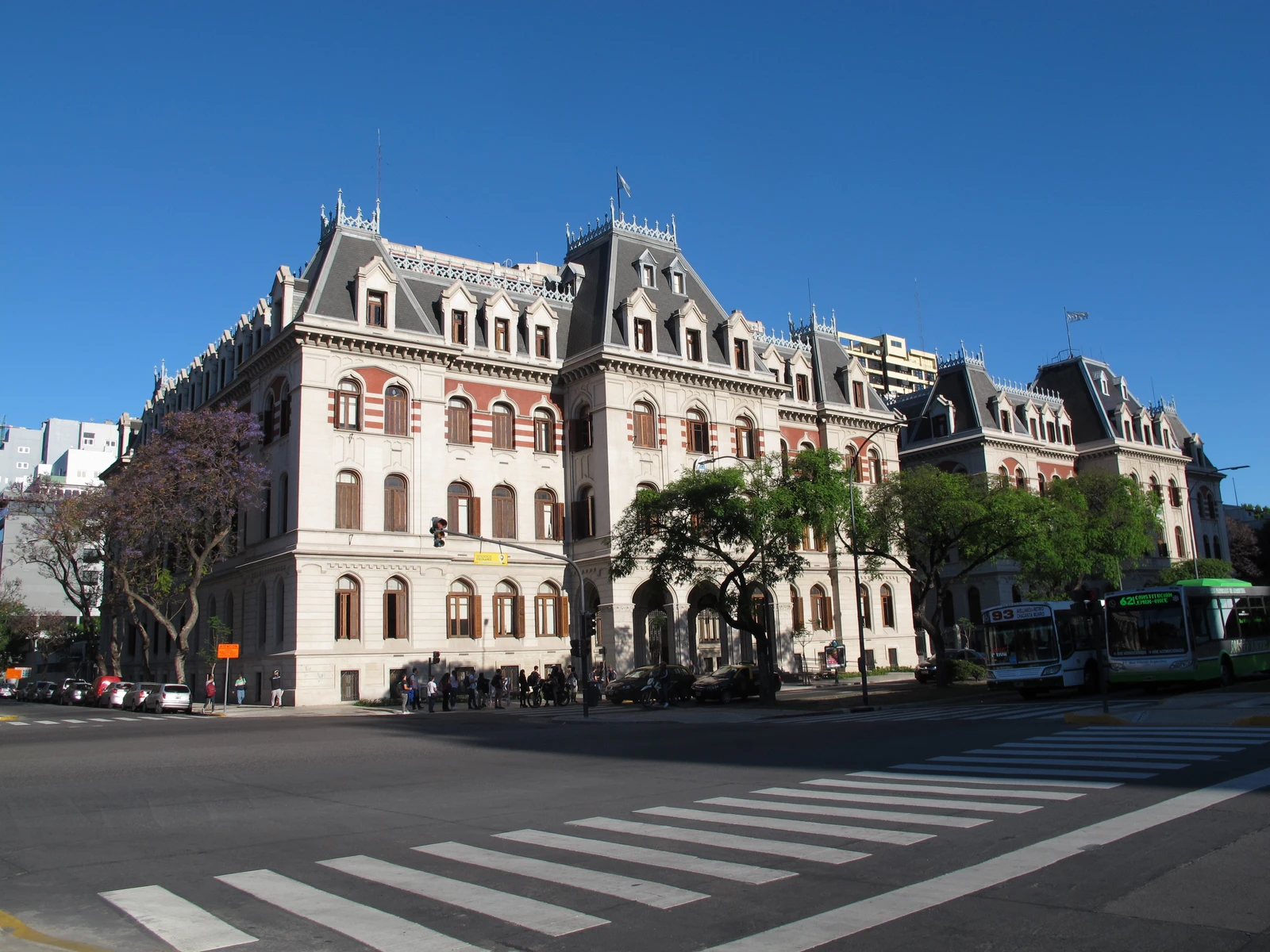 Ministry of Agriculture building in Buenos Aires with trees and crosswalk.