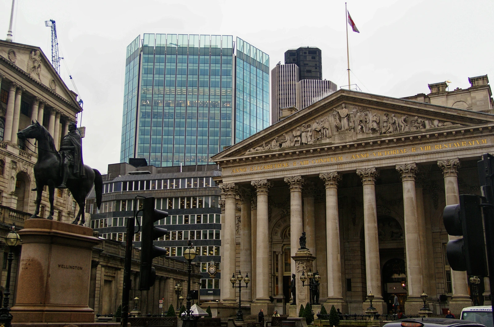 Exterior view of the Royal Exchange building and the equestrian statue of the Duke of Wellington.