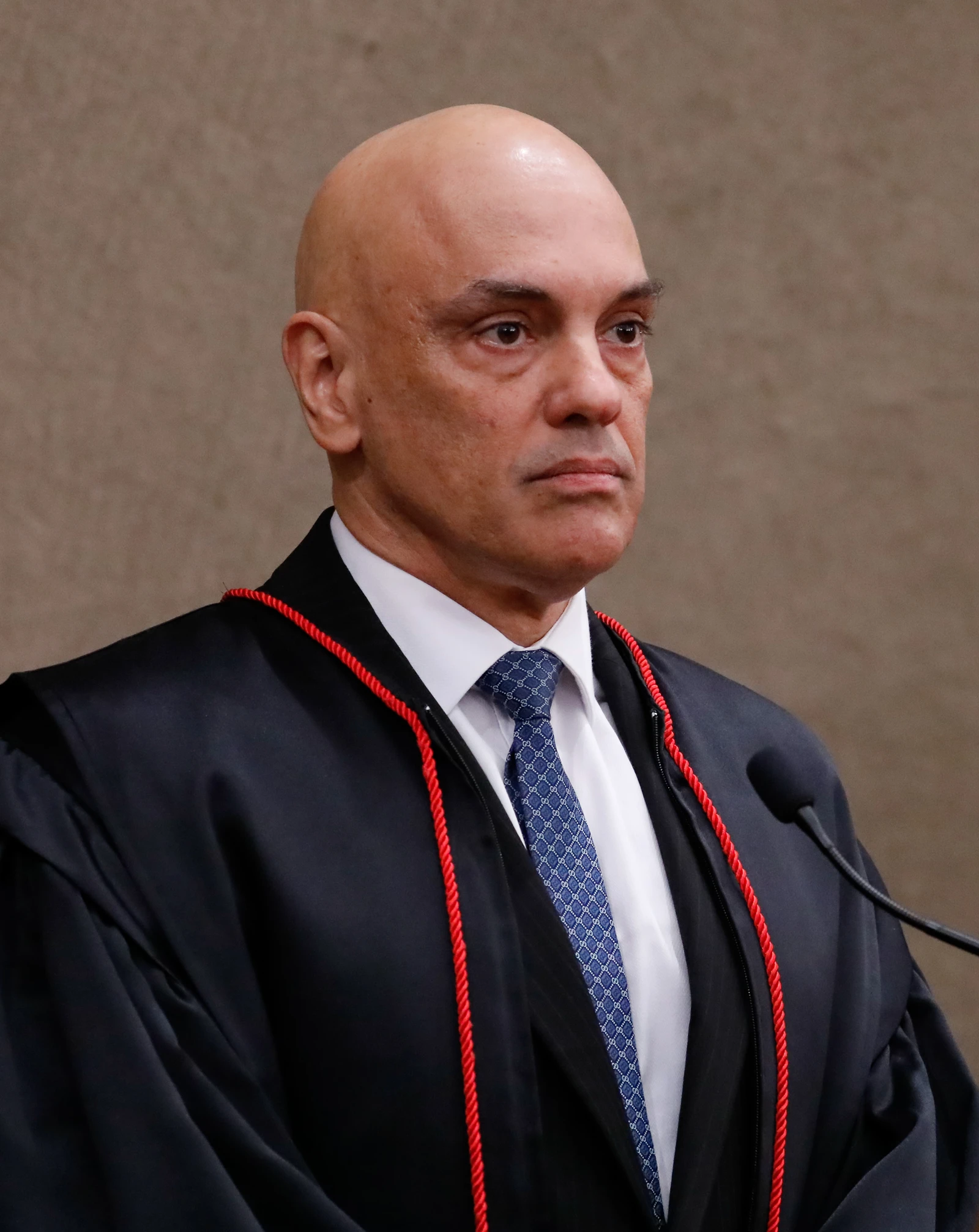 Alexandre de Moraes, President of the Superior Electoral Court, at a podium with a microphone.