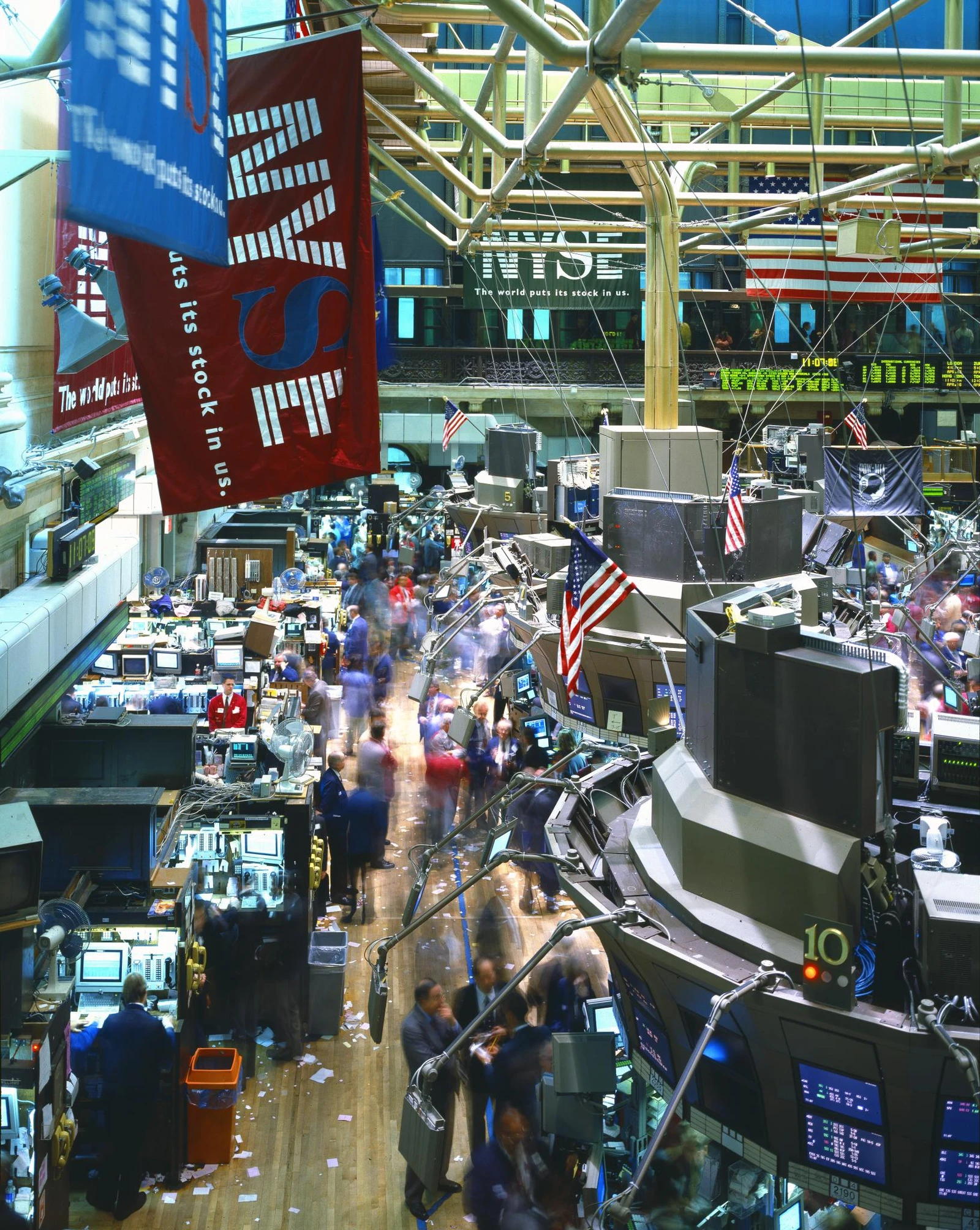 Traders and screens on the busy floor of the New York Stock Exchange.
