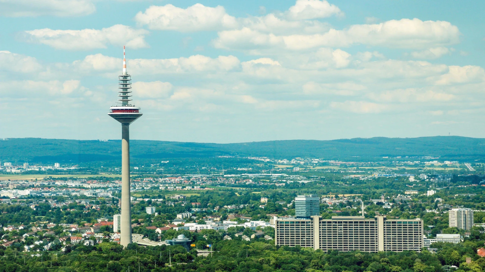 Aerial view of Frankfurt with the Europaturm telecommunications tower and Deutsche Bundesbank building.