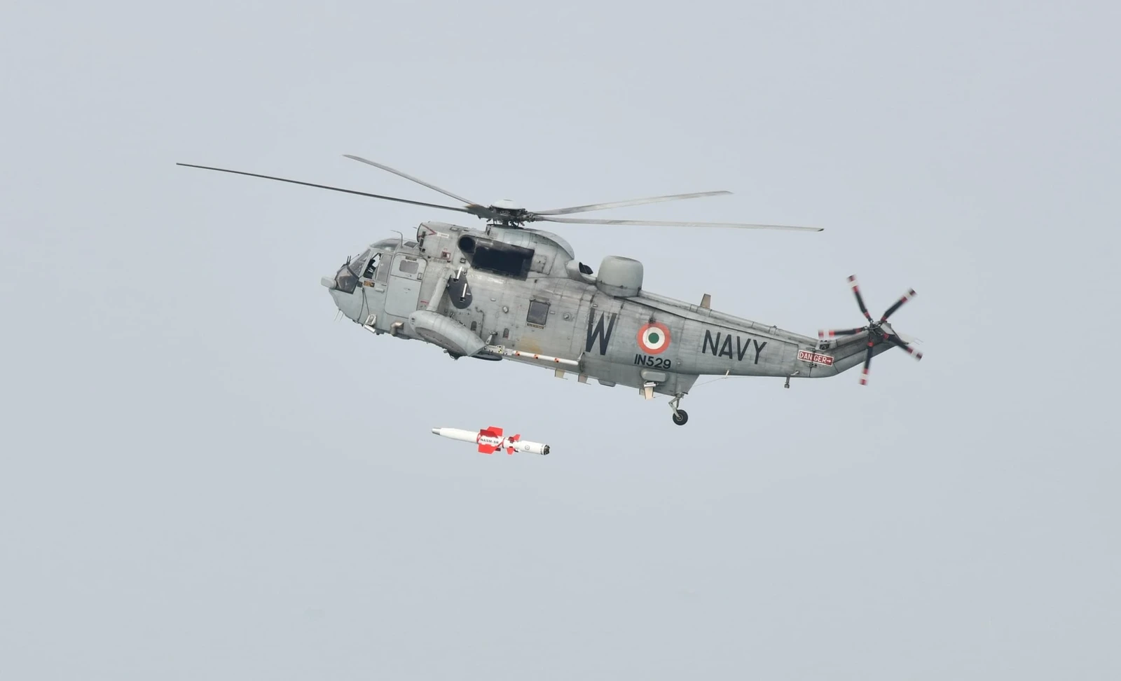 Indian Navy Seaking 42B helicopter launching NASAM-SR anti-ship missile during a test.